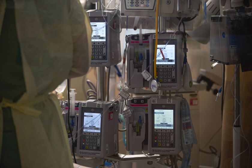 Working inside a negative pressure room on a Covid-19 patient. The various medical equipment used on a patient at Scripps Mercy Hospital Chula Vista intensive care unit on June 24th, 2020 in Chula Vista. Speaking to doctors, nurses and healthcare staff helping patients with Covid-19 at three South Bay hospitals.