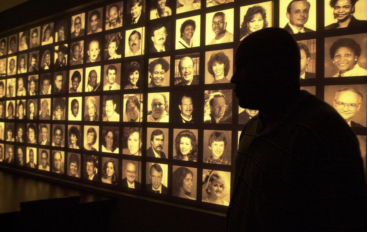 Photographs of the 168 victims of the 1995 bombing of the federal building line a wall at the Oklahoma City National Memorial Center.