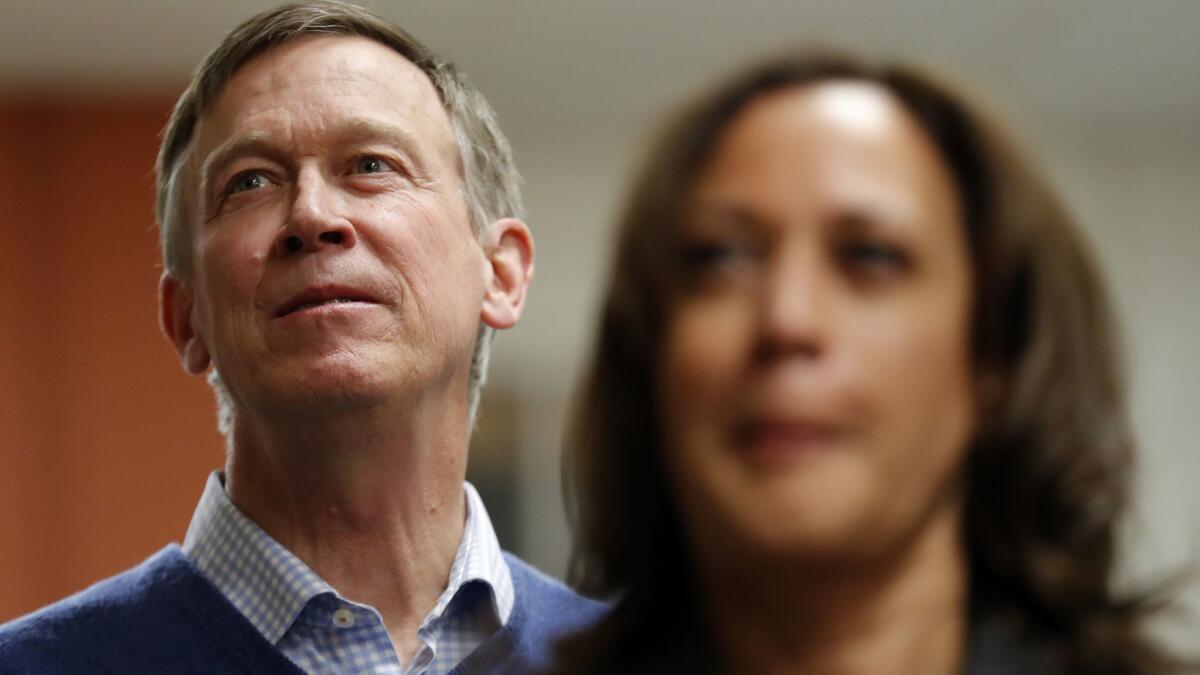 Former Colorado Gov. John Hickenlooper behind California Sen. Kamala Harris at an appearance last month in Iowa. He and other governors hope to eclipse the senators who have dominated the Democratic field so far.