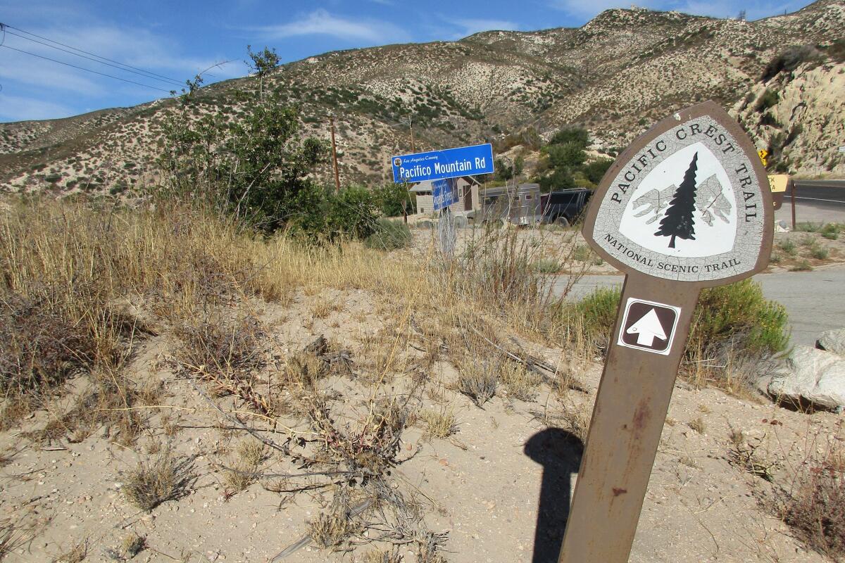 A sign shows the start of the Pacific Crest Trail near Three Points trailhead in the Angeles National Forest.