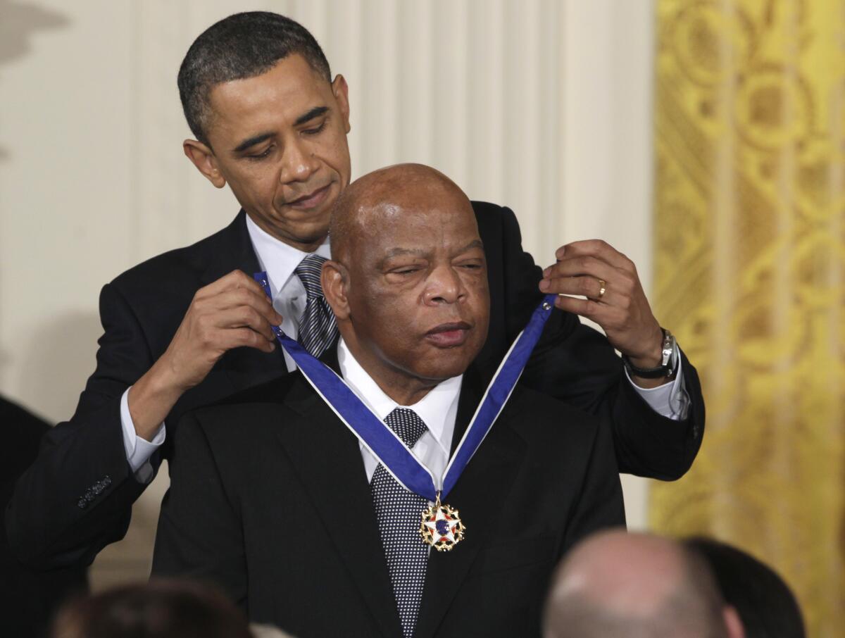 President Obama presents a 2010 Presidential Medal of Freedom to Rep. John Lewis in Washington on Feb. 15, 2011.