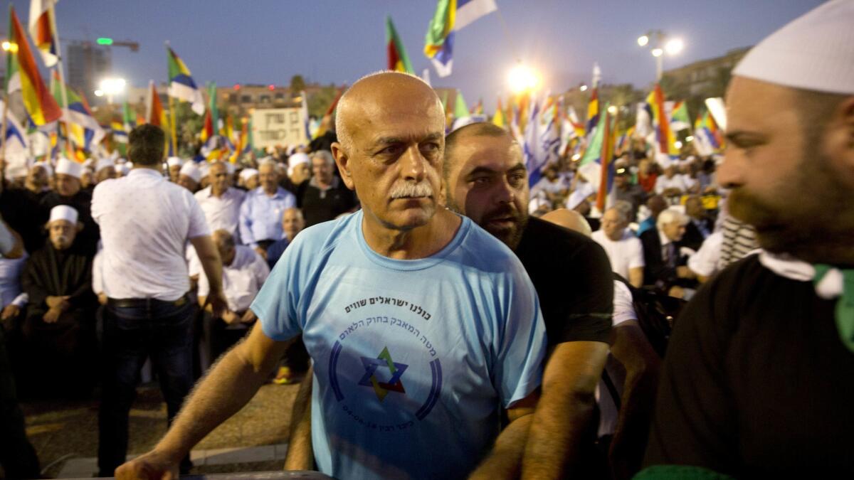 Retired Israeli Brig. Gen. Amal Asad participates in a rally against Israel's nation-state bill in Tel Aviv on Aug. 4, 2018.