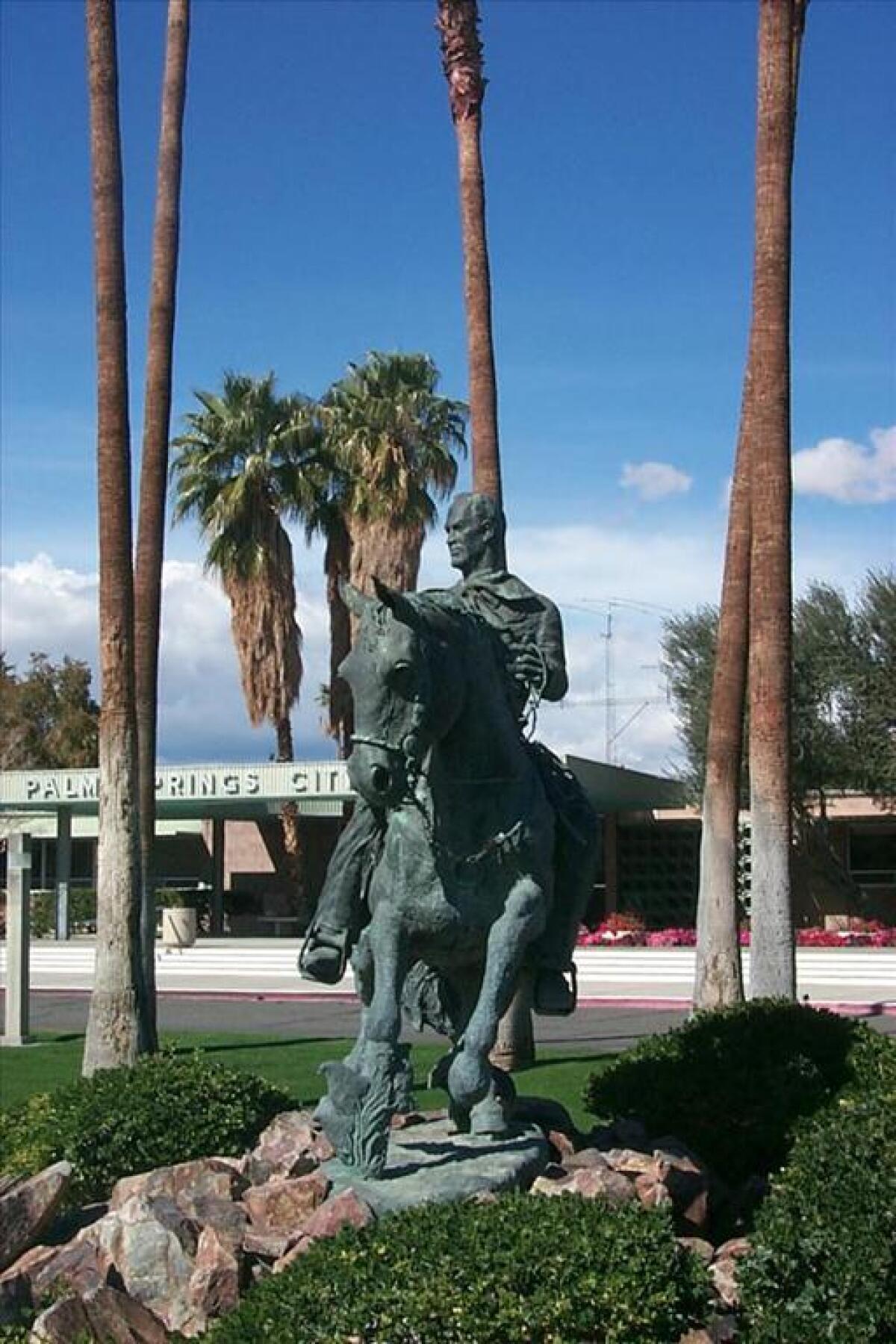 A bronze statue of former Palm Springs Mayor Frank Bogert outside City Hall.
