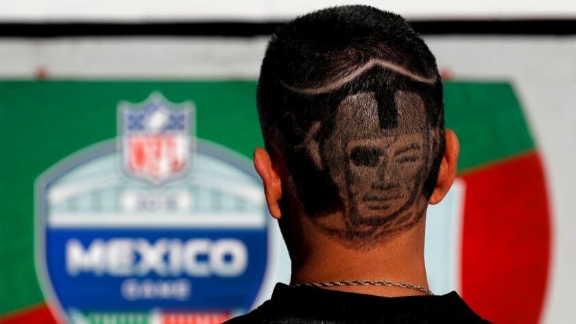 A Oakland Raiders fan arrives at Azteca Stadium before an NFL football game against the Houston Texans Monday, Nov. 21, 2016, in Mexico City.