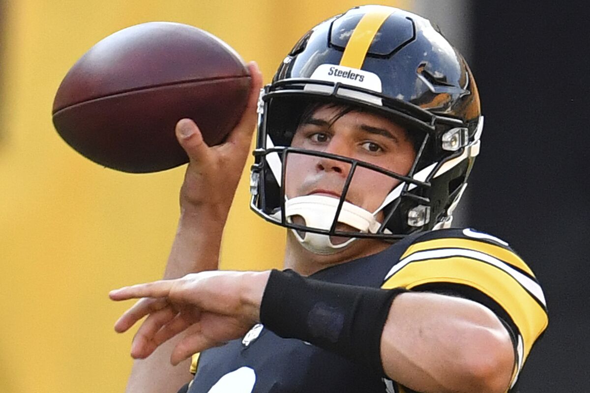FILE - Pittsburgh Steelers quarterback Mason Rudolph drops back to pass during the NFL football team's practice in Pittsburgh, in this Saturday, Aug. 22, 2020, file photo. The Pittsburgh Steelers quarterback is the only signal-caller under contract for next season after signing a one-year deal early this spring, meaning he may get the first shot at replacing Ben Roethlisberger. (Peter Diana/Pittsburgh Post-Gazette via AP, File)
