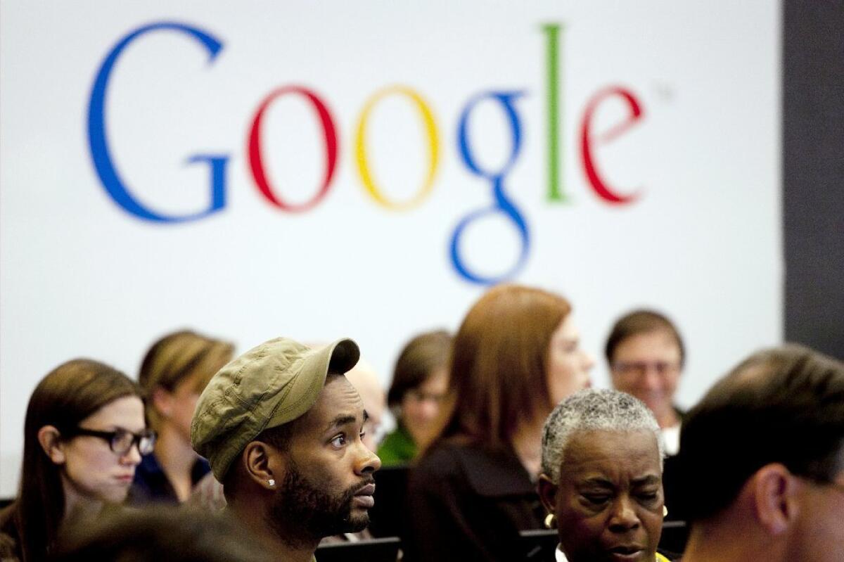 People attend a workshop, "New York Get Your Business Online," at Google offices in New York.