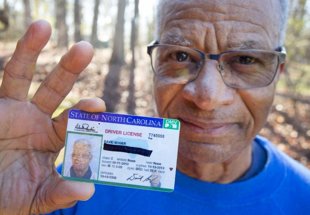 David Boger blacked out his address on a driver's license to protest North Carolina’s voter ID law as he cast his ballot in Greensboro, N.C., on March 15.