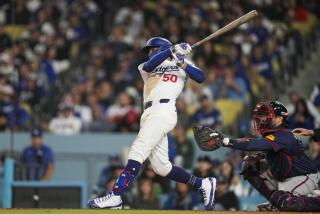 Los Angeles Dodgers' Mookie Betts singles during the seventh inning of a baseball game against the Atlanta Braves in Los Angeles, Saturday, May 4, 2024. James Outman scored. (AP Photo/Ashley Landis)