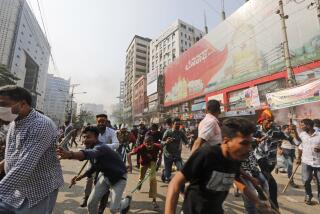 Activists of the Bangladesh Nationalist Party run after clashing with police during a protest in Dhaka, Bangladesh, Saturday, Oct. 28, 2023. Police in Bangladesh's capital fired tear gas to disperse supporters of the main opposition party who threw stones at security officials during a rally demanding the resignation of Prime Minister Sheikh Hasina and the transfer of power to a non-partisan caretaker government to oversee general elections next year. (AP Photo/Mahmud Hossain Opu)