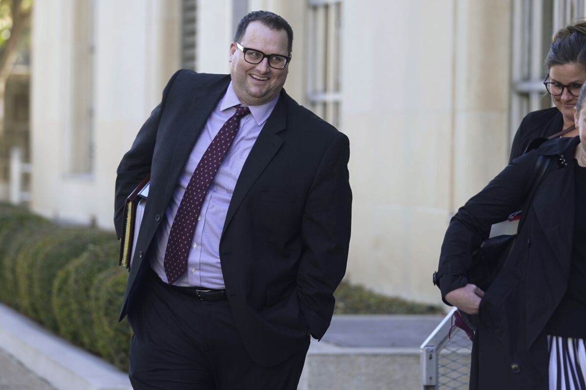 Former Los Angeles Angels employee Eric Kay walks out of federal court where he is on trial for federal drug distribution and conspiracy charges, in Fort Worth, Texas, Tuesday, Feb. 15, 2022. Kay is accused of providing Tyler Skaggs the drugs that led to the pitcher's overdose death. The 27-year-old Skaggs was found dead in July 2019 in a suburban Dallas hotel room. He had choked to death on his vomit, and a toxic mix of alcohol, fentanyl and oxycodone was in his system. (AP Photo/LM Otero)