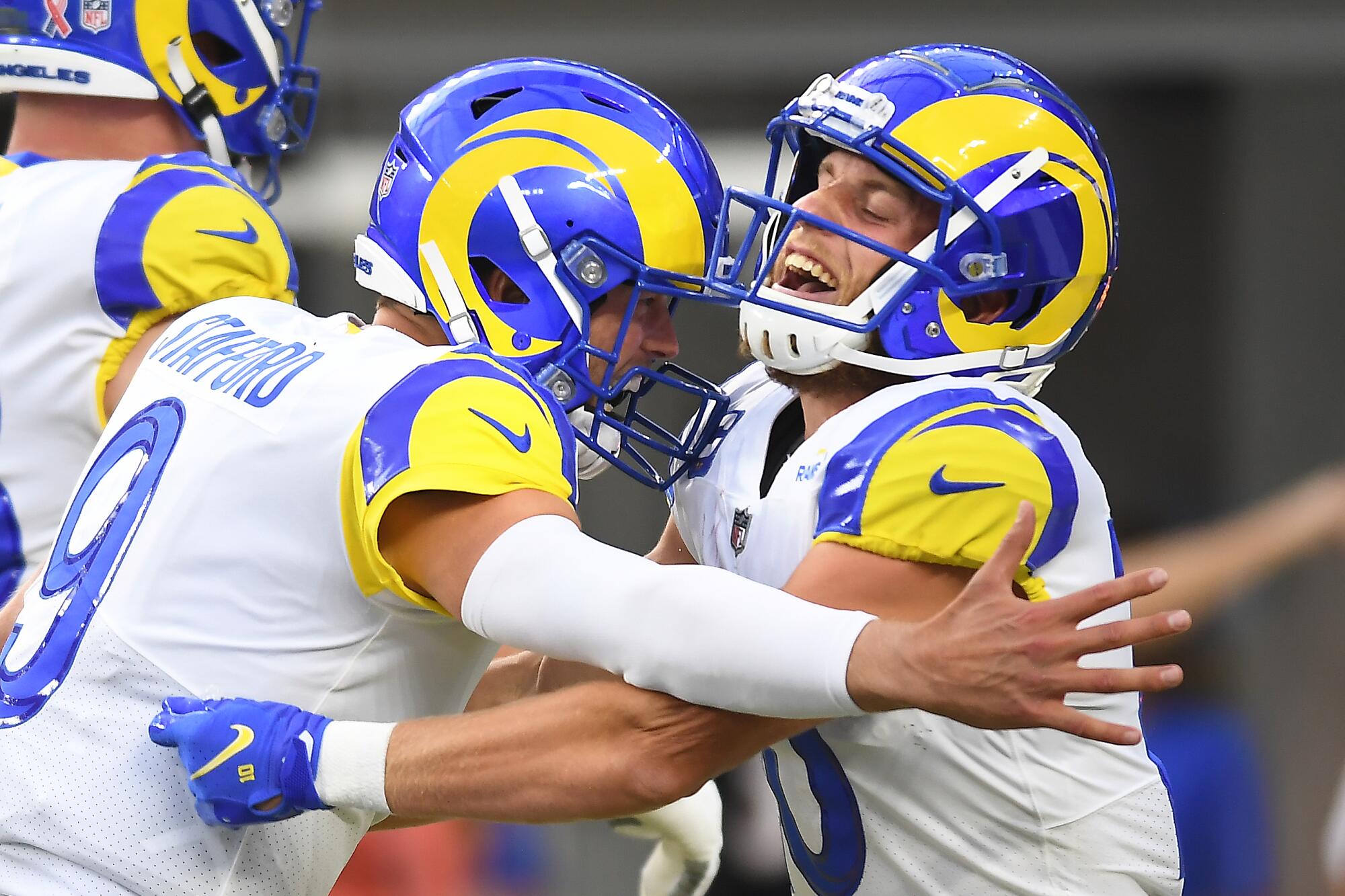 Inglewood, CA. September 12, 2021: Rams quarterback Matthew Stafford, left, celebrates his touchdown pass.