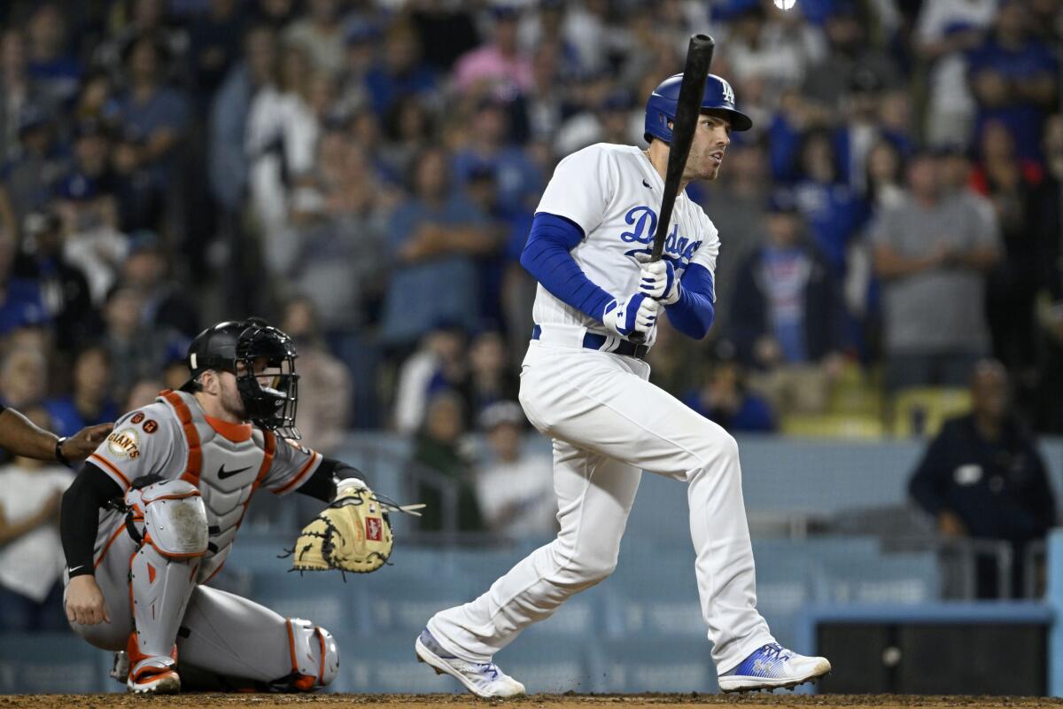 Dodgers' Freddie Freeman hits an RBI single against the San Francisco Giants on Sept. 22, 2023, at Dodger Stadium.