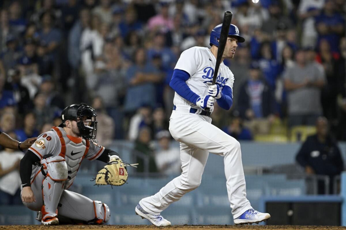 Dodgers' Freddie Freeman hits an RBI single against the San Francisco Giants on  Sept. 22, 2023, at Dodger Stadium.