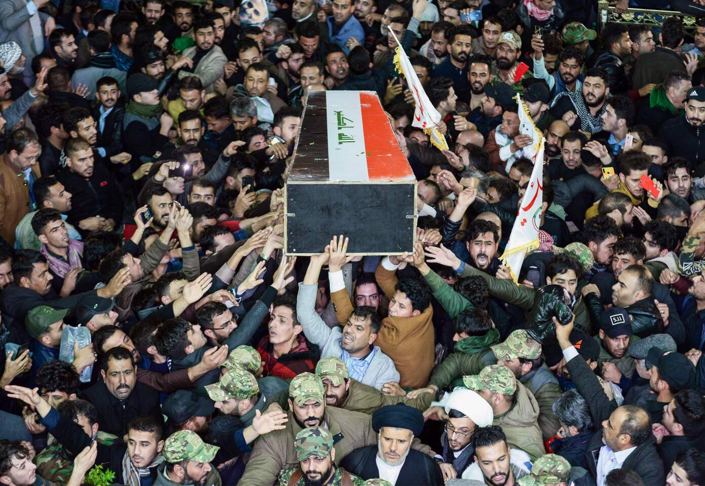 Mourners carry the coffin of slain Iraqi paramilitary chief Abu Mahdi Muhandis in Najaf, Iraq.