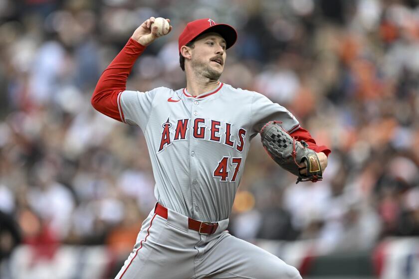Los Angeles Angels starting pitcher Griffin Canning (47) throws during the first inning.