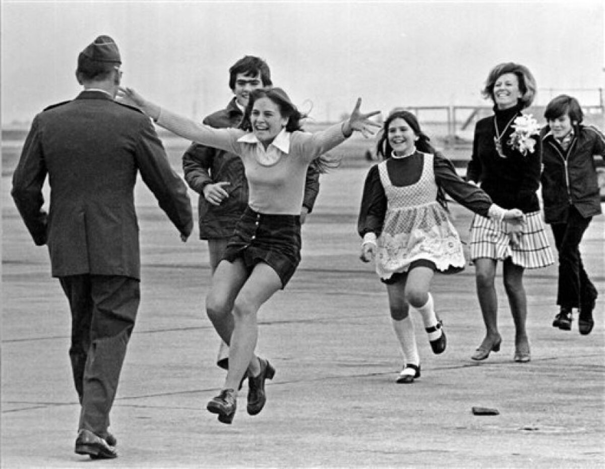This March 17, 1973 file photo shows released prisoner of war Lt. Col. Robert L. Stirm being greeted by his family at Travis Air Force Base in Fairfield, Calif.
