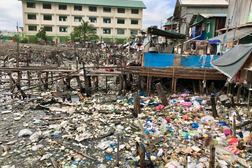 Plastic litter collects in a vacant field in Navotas, a suburb of Manila.