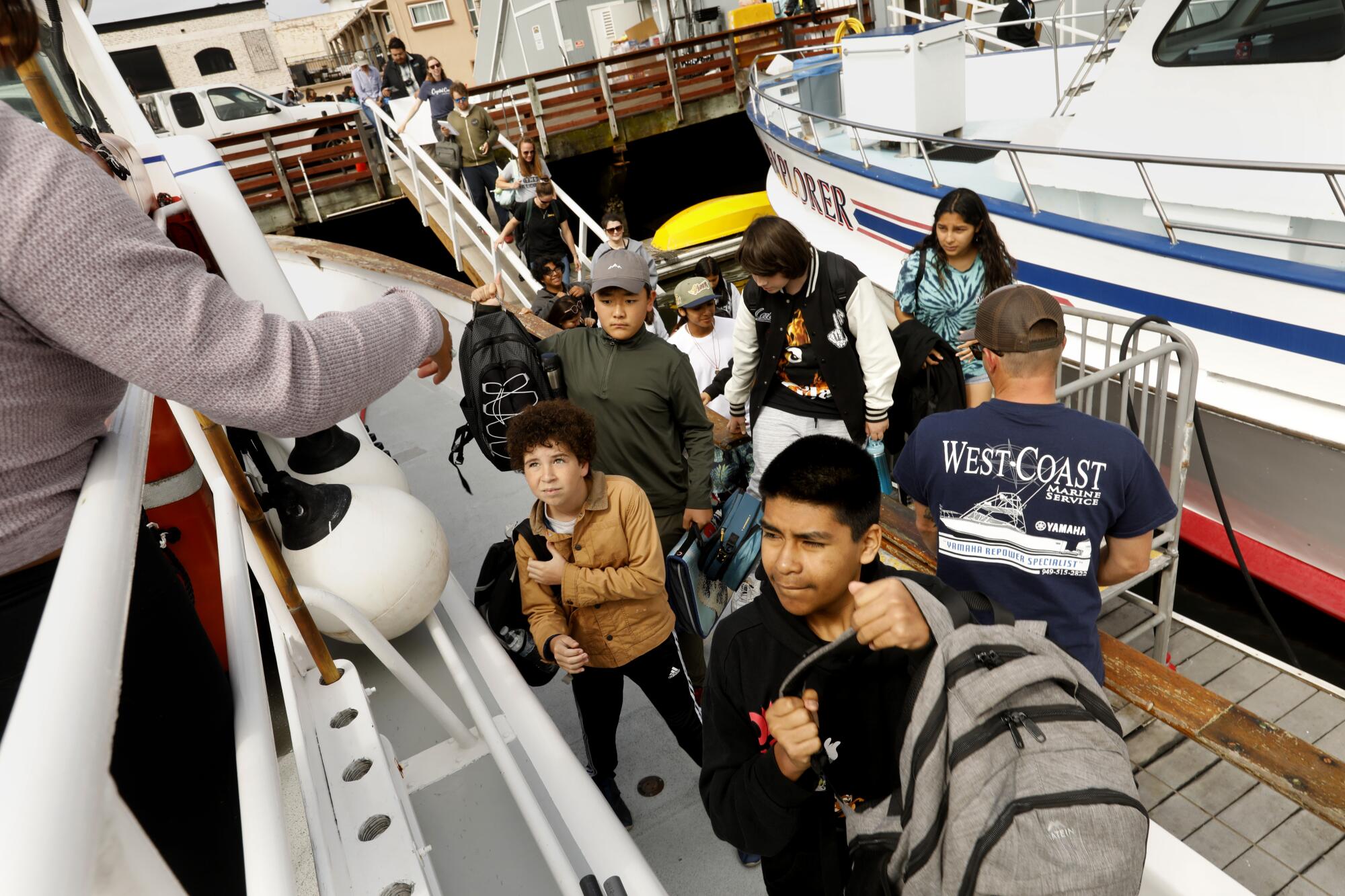 Students board a boat