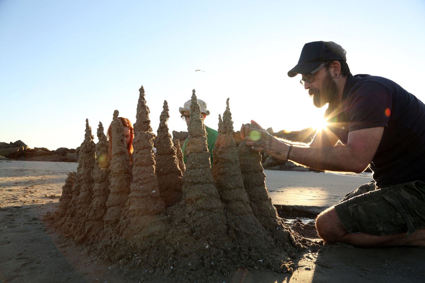 Basilios Papaioannou of West Hollywood builds a drip castle in the sand at Venice Beach.