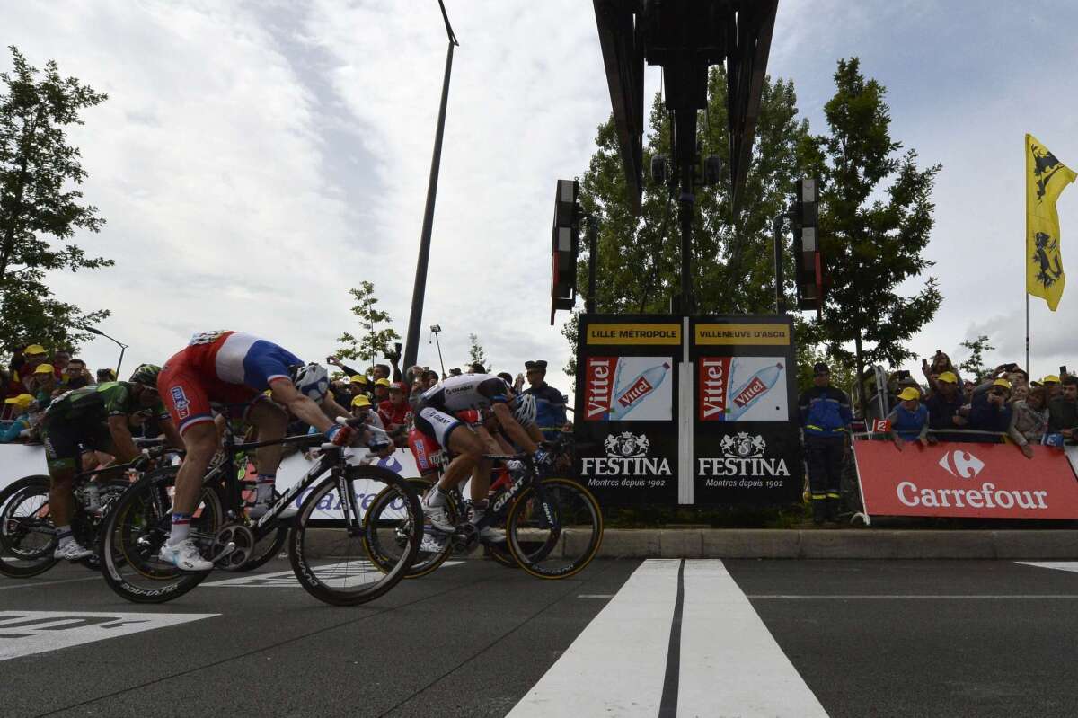 Germany's Marcel Kittel crosses the finish line ahead of the pack to win the fourth stage of the Tour de France.