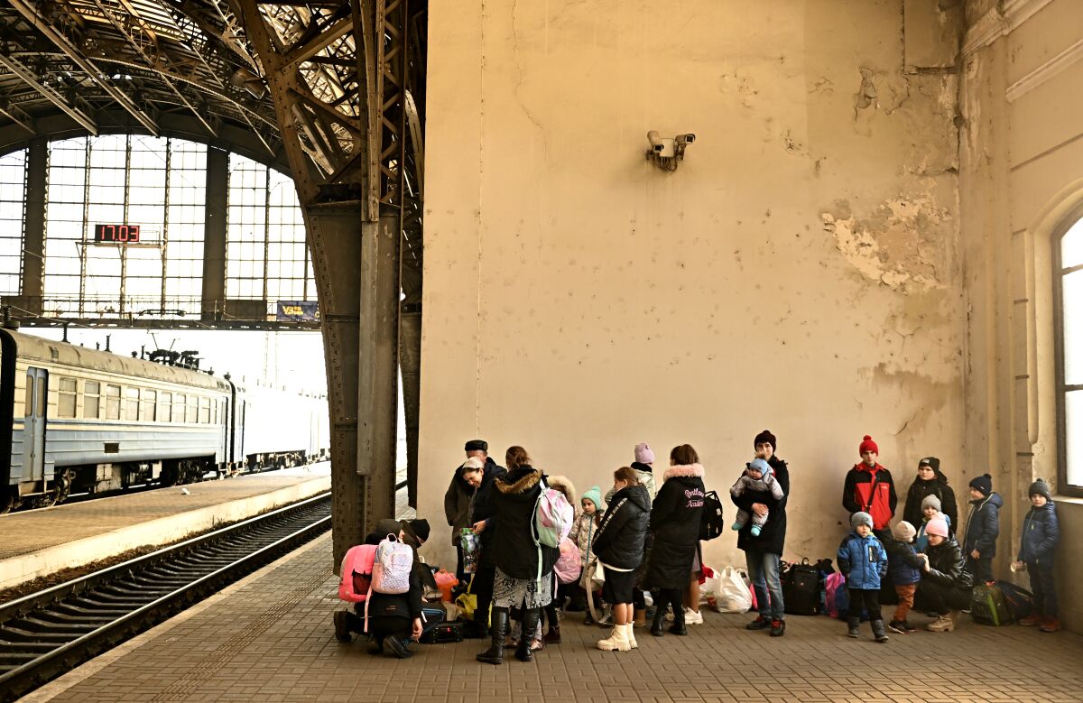 People at a train station.
