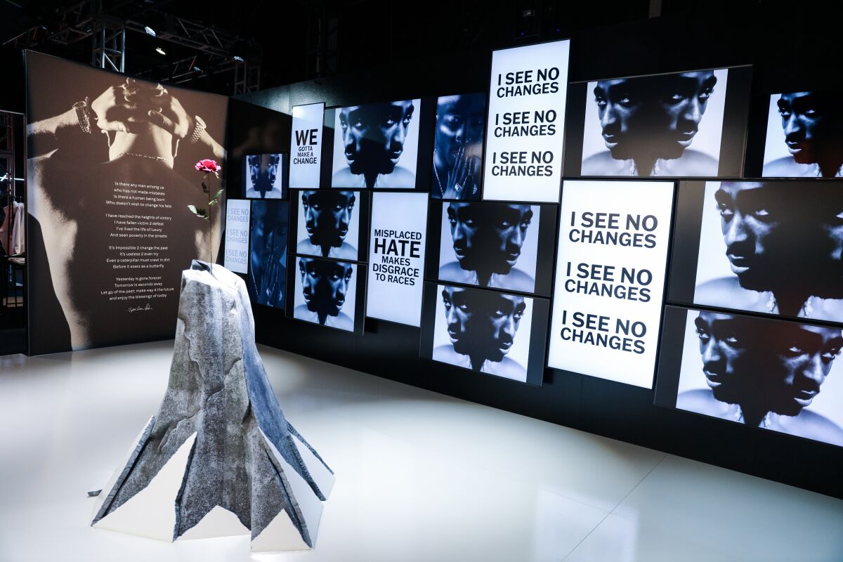 A museum installation with a sculpture at center