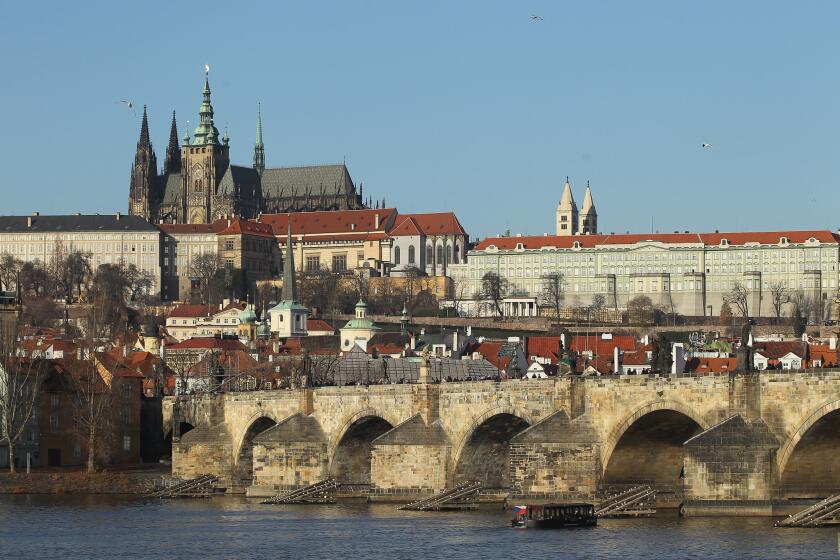 Prague Castle (Hradcany) looms over Lesser Town (Mala Strana) district, Charles Bridge and the Moldau (Vltava) River on Dec. 19, 2011, in Prague, Czech Republic. Prague is among Europe's most popular travel destinations.