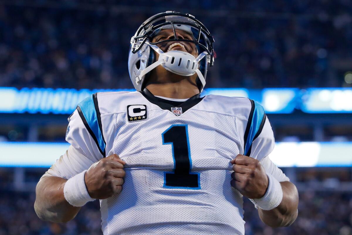 Panthers quarterback Cam Newton celebrates after scoring a touchdown in the third quarter during the NFC Championship Game.