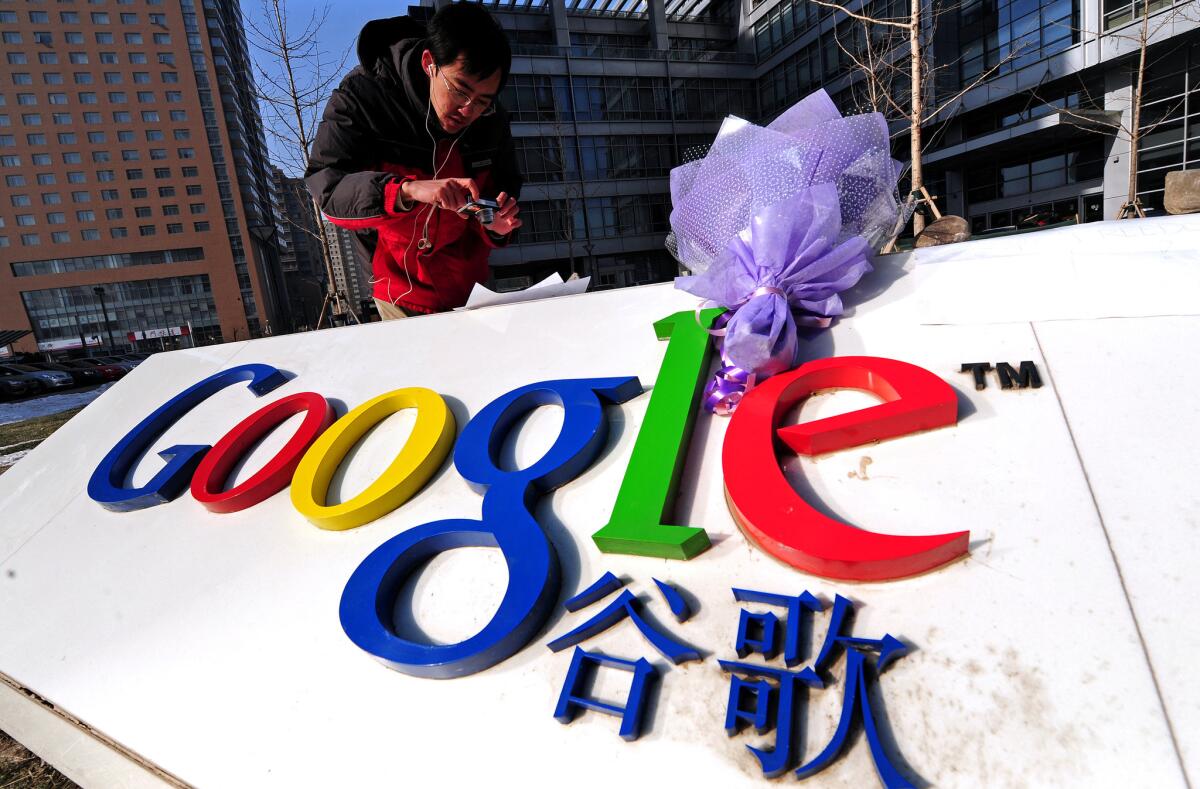 A bouquet of flowers lay upon the company logo outside the Google China headquarters in Beijing on Jan. 14, 2010. Google stopped mainland search in China that year.