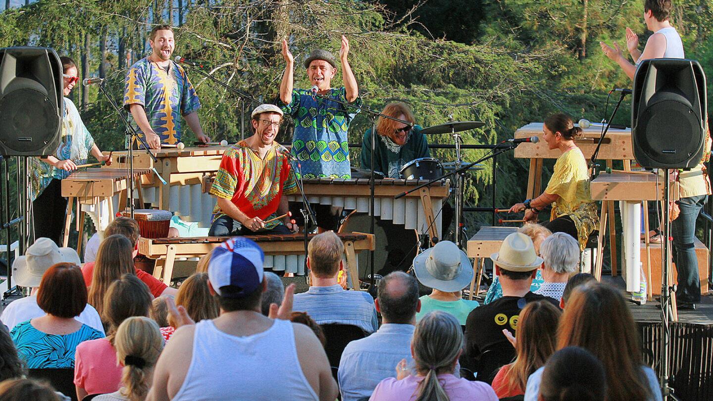 Masanga Marimba kicks off the a summer concert series at the Brand Library and Art Center in Glendale on Friday, June 3, 2016. The band plays traditional and popular music from Africa and Latin America using instruments like Zimbabwean marimbas of various sizes along with vocals, drums, percussion, saxophone and trumpet. The summer concert series will be Fridays, starting at 7:00, through August 26. Ric Aliviso, an African music, dance and world music professor at Cal State Northridge University, with students from his class, perform in the band.