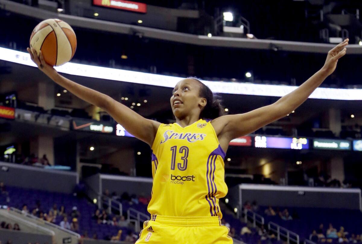 Los Angeles Sparks forward Farhiya Abdi goes up for a layup against the Seattle Storm.