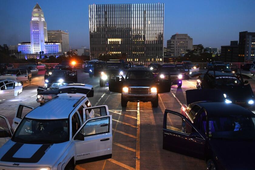 LOS ANGELES-CA-OCTOBER 15, 2017: As part of Red Bull Music Academy Festival Los Angeles, renowned artist Ryoji Ikeda presents a brand-new composition, in collaboration with 100 automobile owners in downtown Los Angeles on Sunday, October 15, 2017. (Christina House / Los Angeles Times)