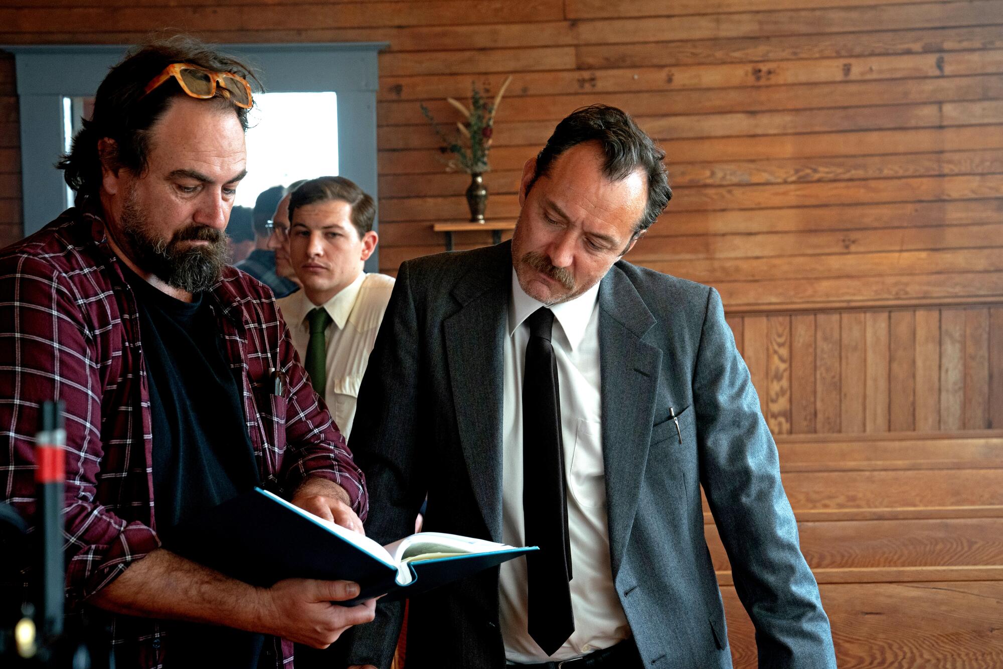 Jude Law and director Justin Kurzel chat on set.