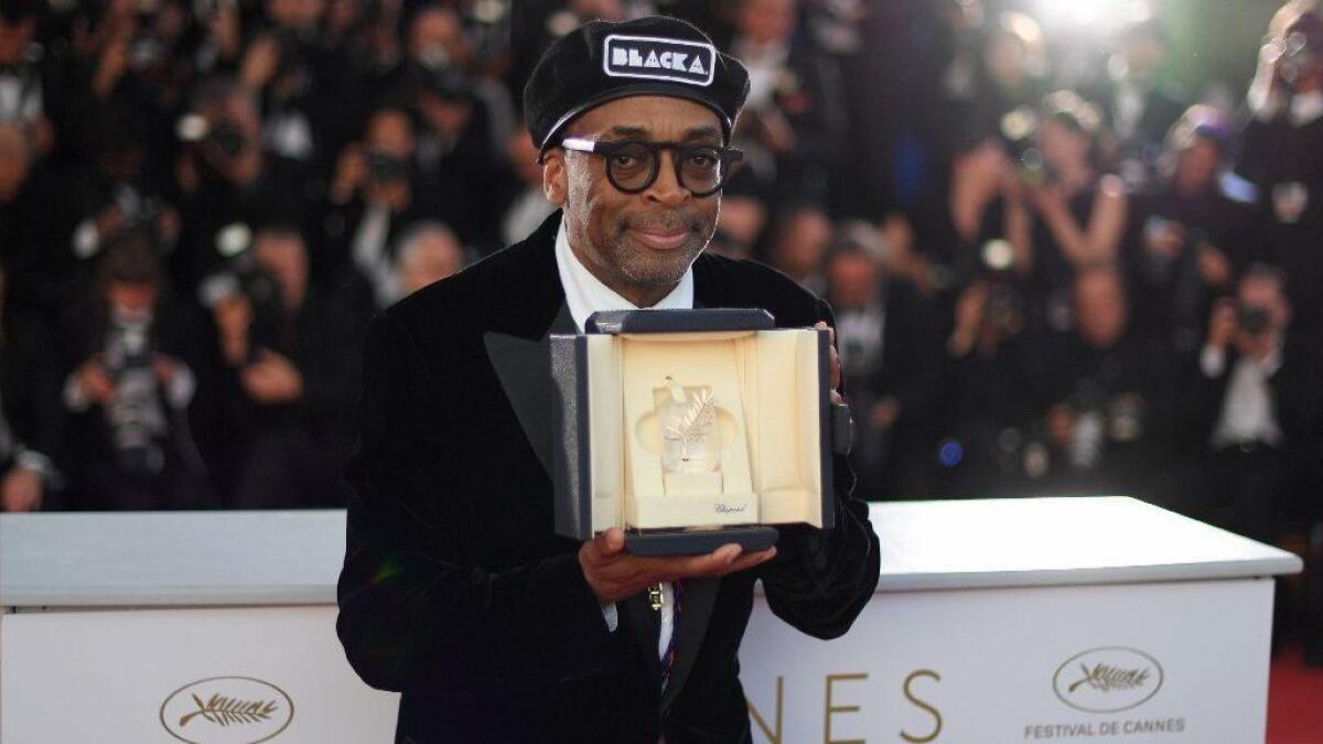 Director Spike Lee poses with his trophy on May 19 during a photocall after he won the Grand Prix for the film "BlacKkKlansman" at the 71st edition of the Cannes Film Festival.