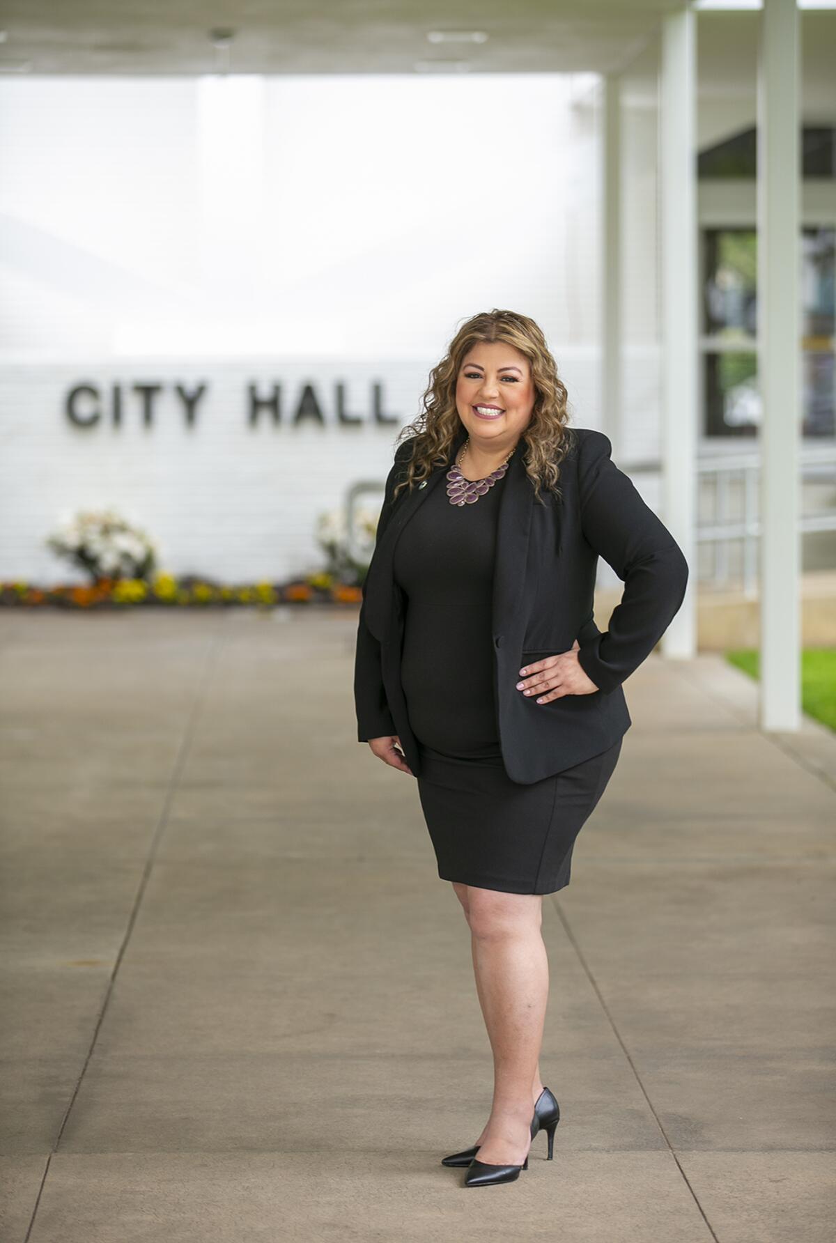 Alma Reyes, seen Tuesday outside City Hall, was recently hired to serve as Deputy City Manager for the city of Costa Mesa. 