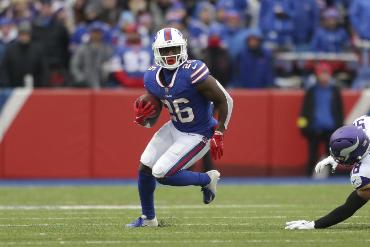 Buffalo Bills running back Devin Singletary runs with the ball in the first half against the Minnesota Vikings.