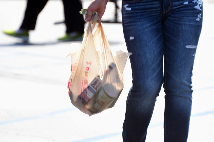 The Huntington Beach City Council voted to repeal a citywide ban on plastic bags as well as the 10-cent paper bag fee.