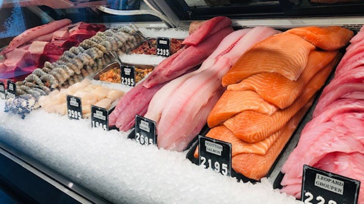 The display case at the entrance of Blue Water Seafood features fresh fish cut to order.