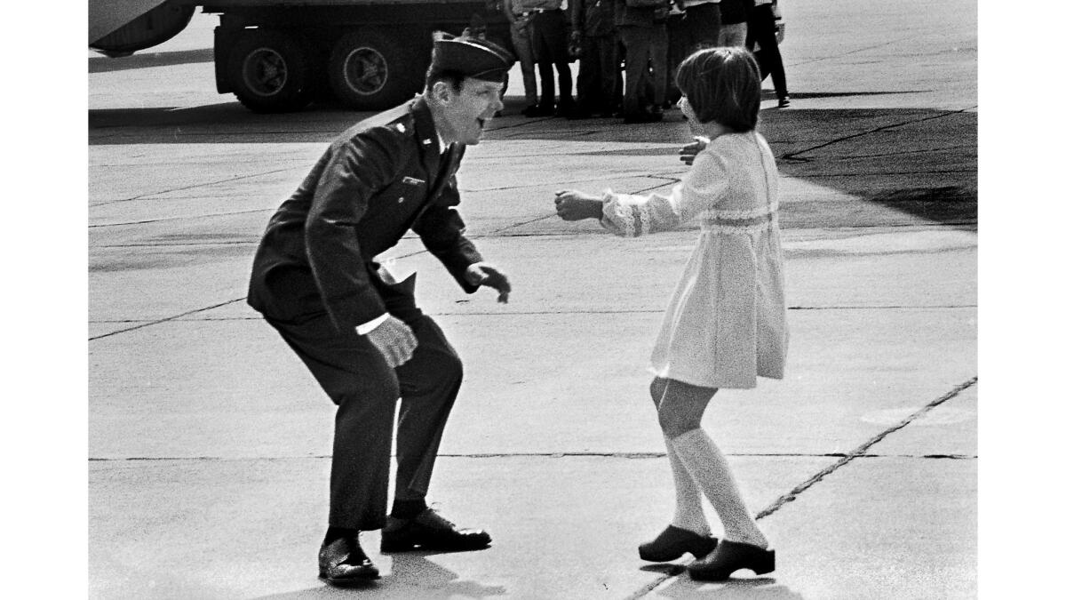 March 17, 1973: Heidi Hess, 9, runs to greet her father, Air Force Maj. Jay C. Hess, at March Air Force Base following his release by the North Vietnamese.