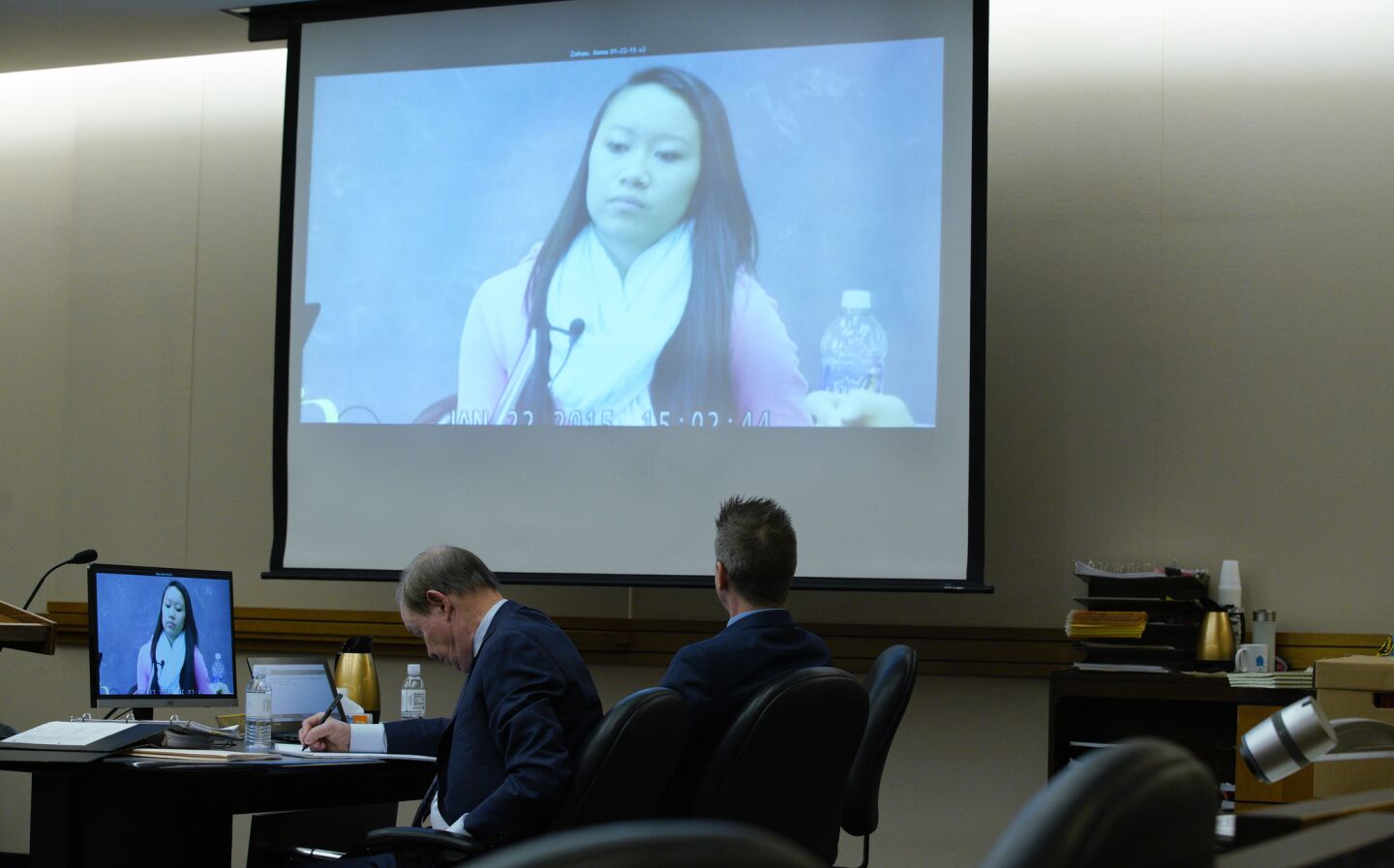 Adam Shacknai (right) sits next to his attorney, Dan Webb as a video is played of Rebecca Zahau's younger sister Xena Zahau taken during her January 22, 2015 deposition.