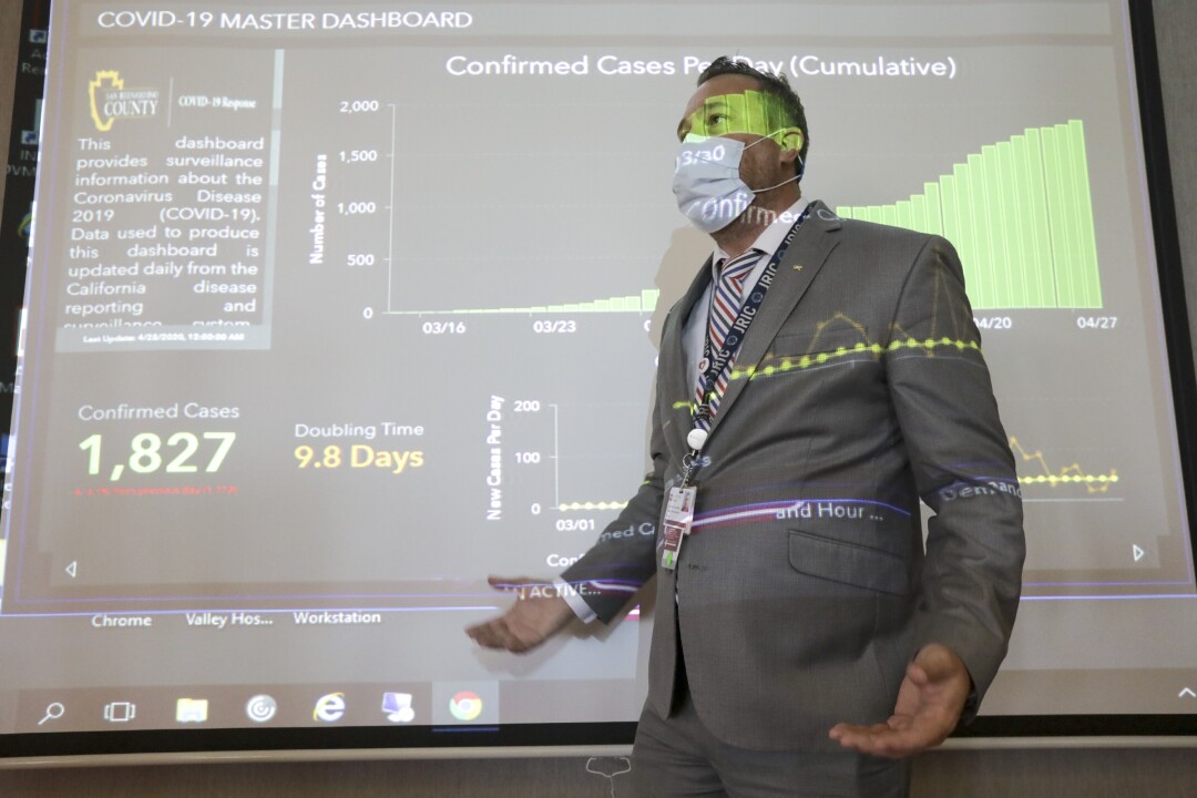 A patient's return to hospital COVID-19 unit underscores
uncertainty to come 6 Brian Lugo, head of COVID-19 Response Team