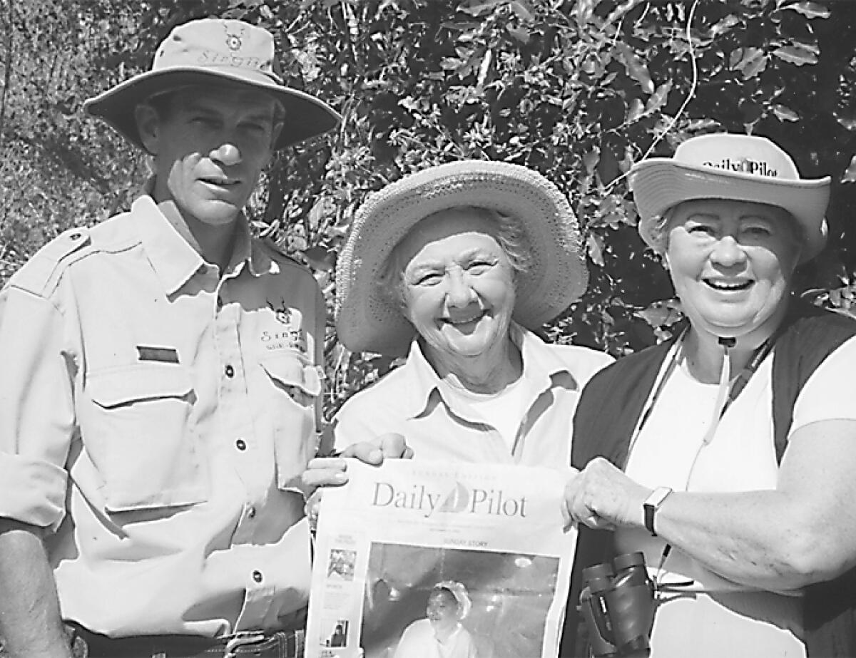 Sandy Sewell, right, with guide Lee Bennett, left, and friend Arden Flamson on a safari in South Africa in 2002.