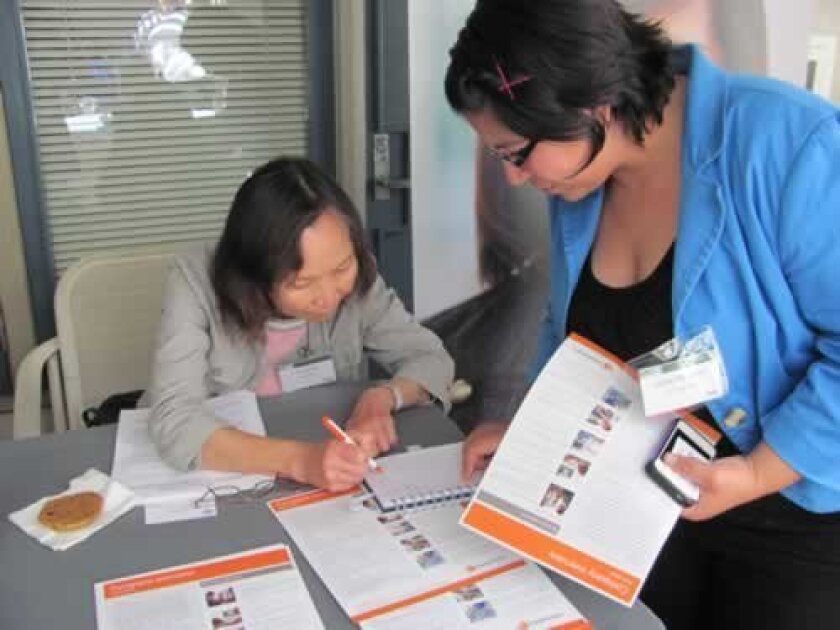 Li-Huey Wu of CareFusion assists a student.
