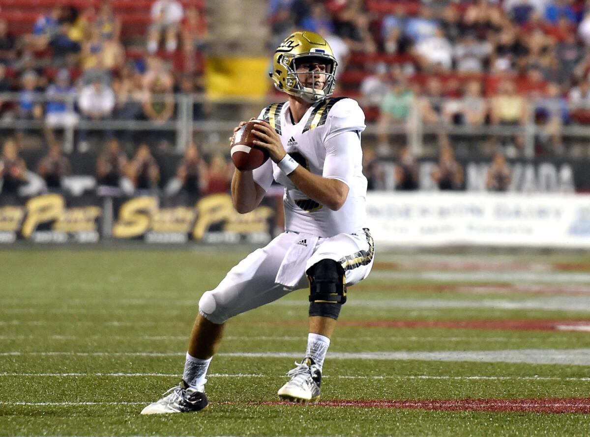 Bruins quarterback Josh Rosen sets up to pass against the Rebels in the second half Saturday at Sam Boyd Stadium.