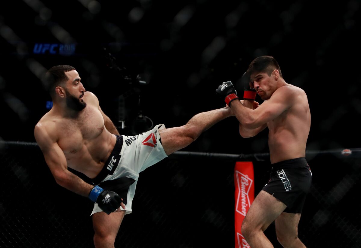 Belal Muhammad lands a kick during his fight against Vicente Luque in a welterweight bout at UFC 205.
