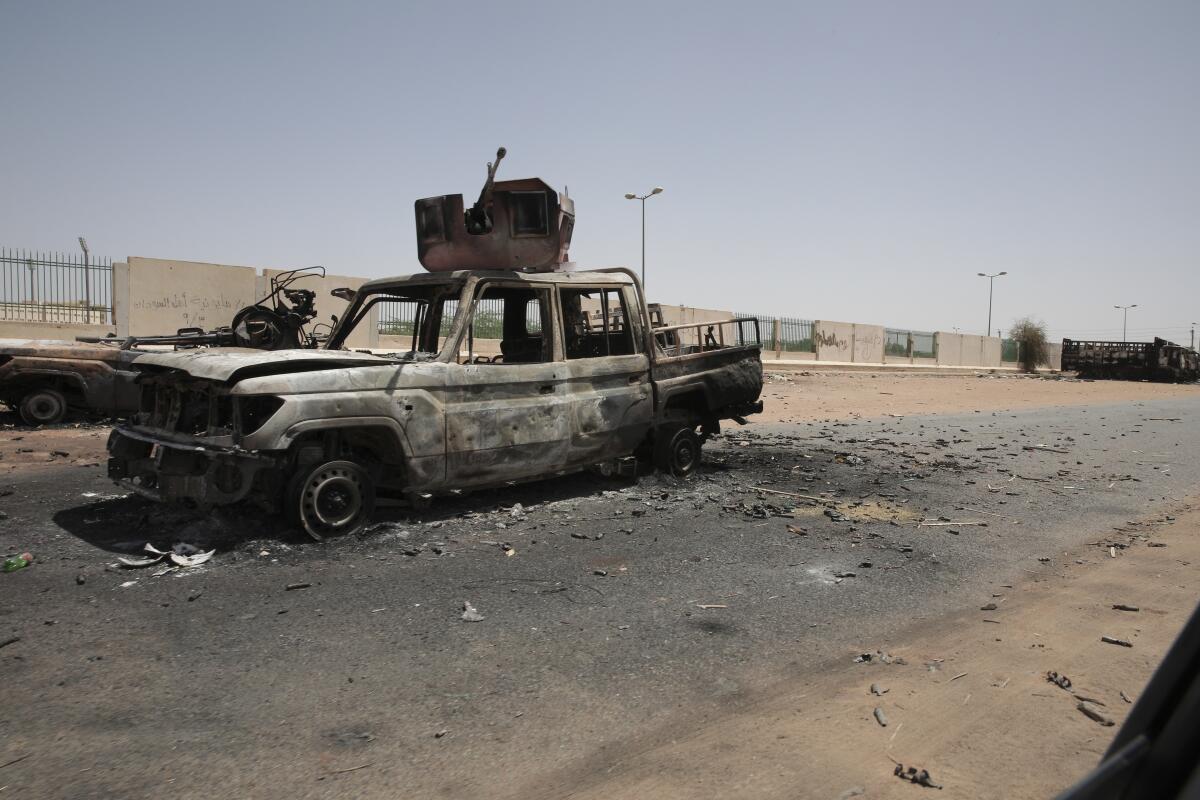 A blackened car in Khartoum, Sudan