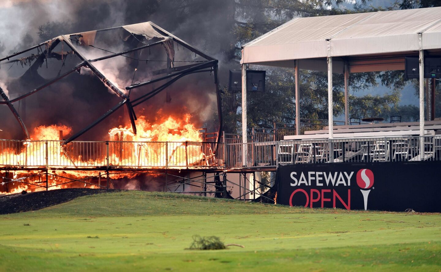 A tent structure built for the 2017 Safeway Open burns in Napa on Monday.