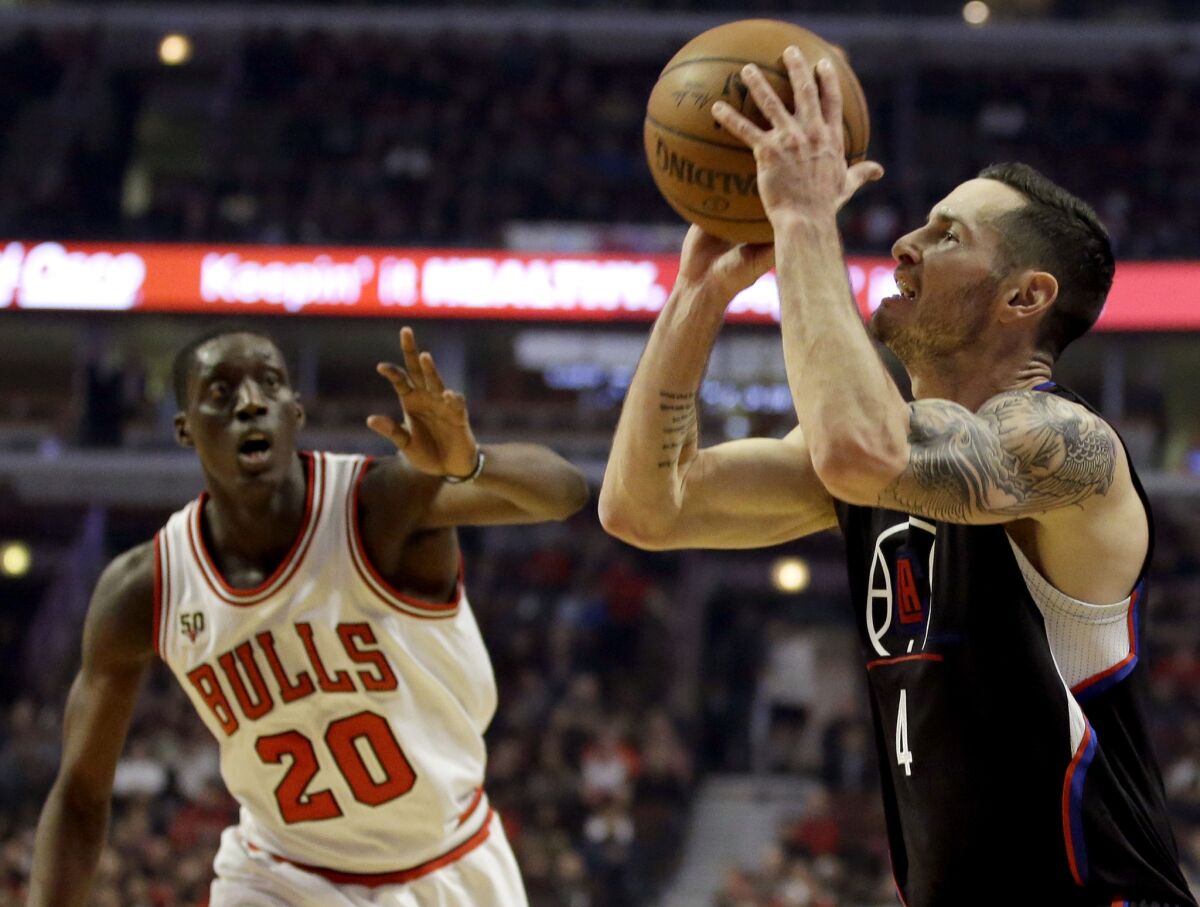 Clippers guard J.J. Redick, right, shoots against Bulls forward Tony Snell during the first half on Thursday.