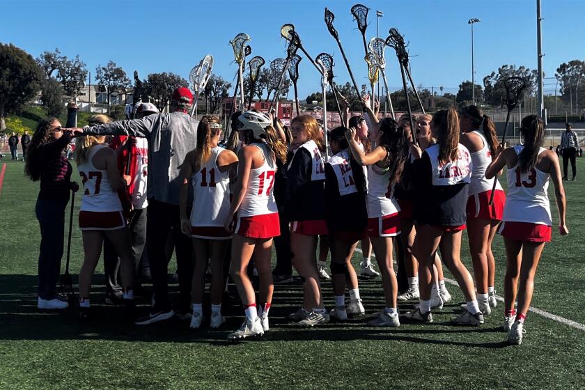 The Redondo Union girls' lacross team huddles after their game against Mira Costa on Wednesday afternoon.