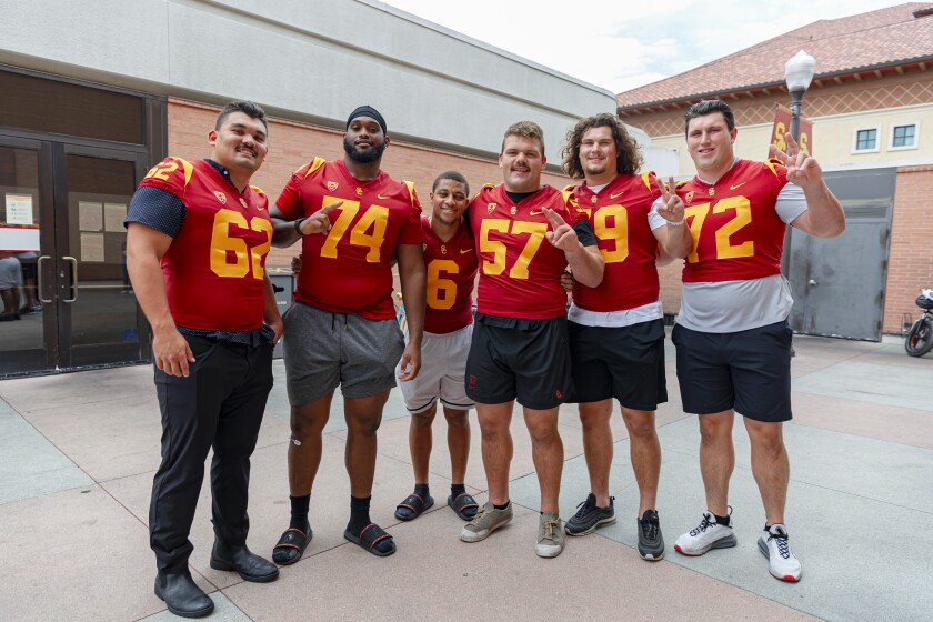 USC football players pose at media day Aug. 4, 2022, in Los Angeles.